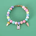 Macaron-colour pet collar with moon and pearl resin charms and a matching bracelet.