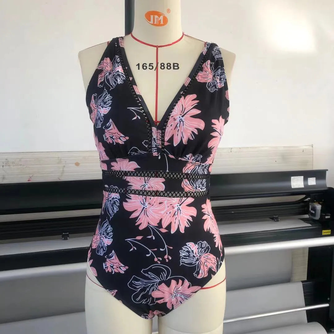 Black floral print plus size women's bikini swimsuit made from polyester mesh fabric.