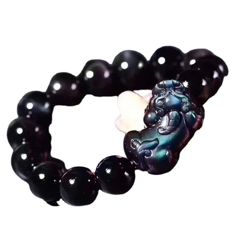Natural ice colour eye obsidian crystal bracelet on an elastic band, showing bead detail.