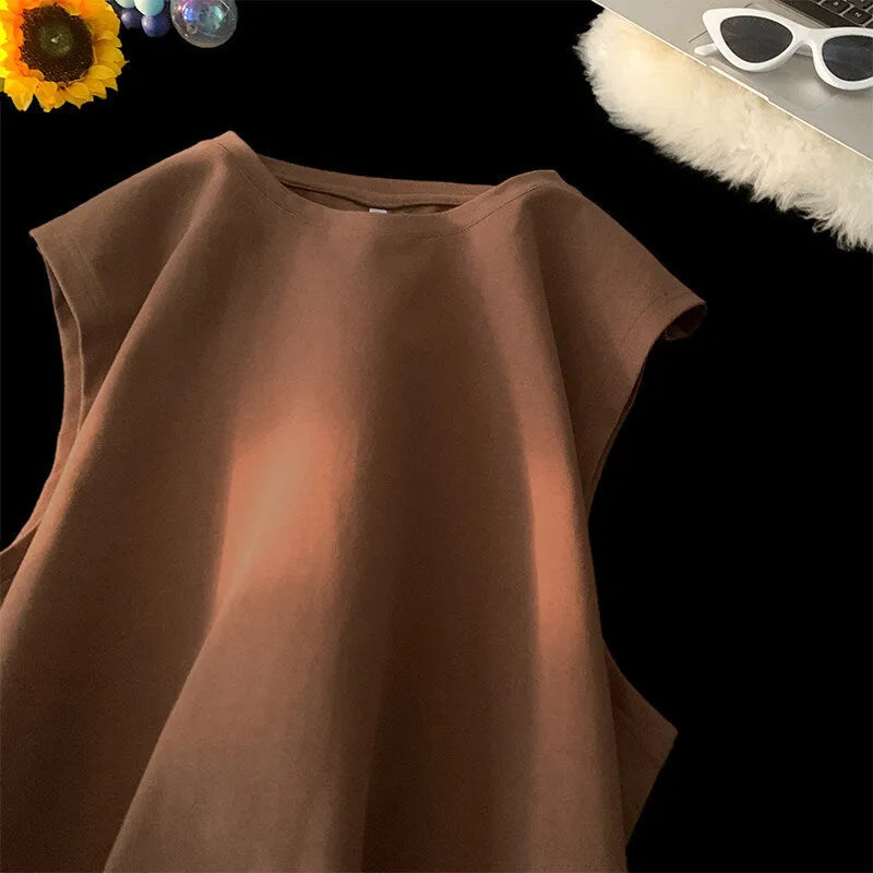 Men's loose cotton tank top in dark grey showing straight hem design and sleeveless construction