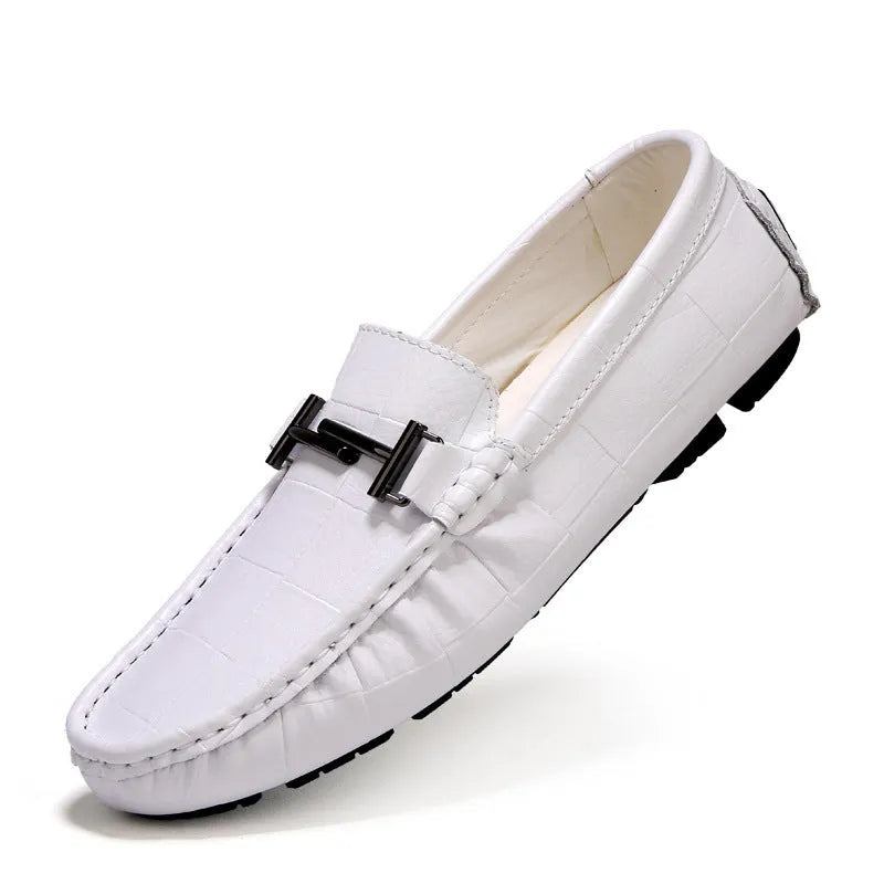 Men's brown leather casual loafers with a silver buckle on the front, shown from a side angle.