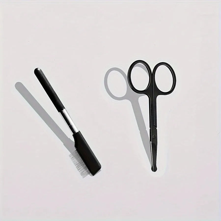 Black pet grooming brush with a soft rubber tear stain remover tool and a plastic comb on an ambidextrous handle.