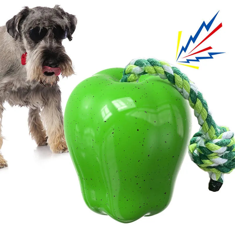 Green Apple-shaped plastic dog toy with dropping ball design containing squeaker