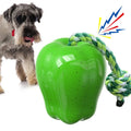 Green Apple-shaped plastic dog toy with dropping ball design containing squeaker