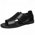 Men's black and brown Roman-style open-toe sandals with a leather upper and rubber sole.