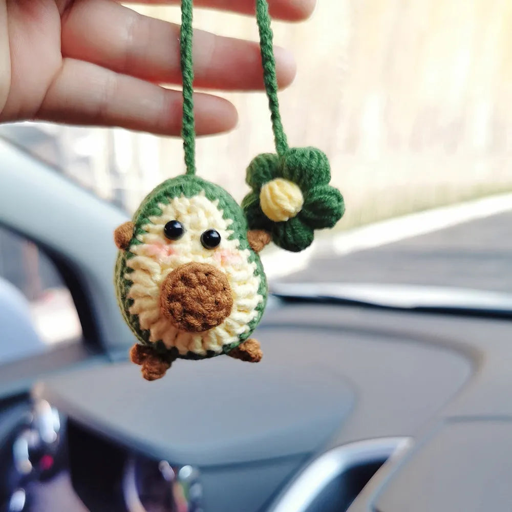 Handmade crocheted car pendant in avocado, pink rainbow, and red rainbow colour designs