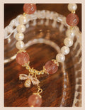 Crystal bracelet with strawberry quartz stringed pearls and bow detail for female summer wear