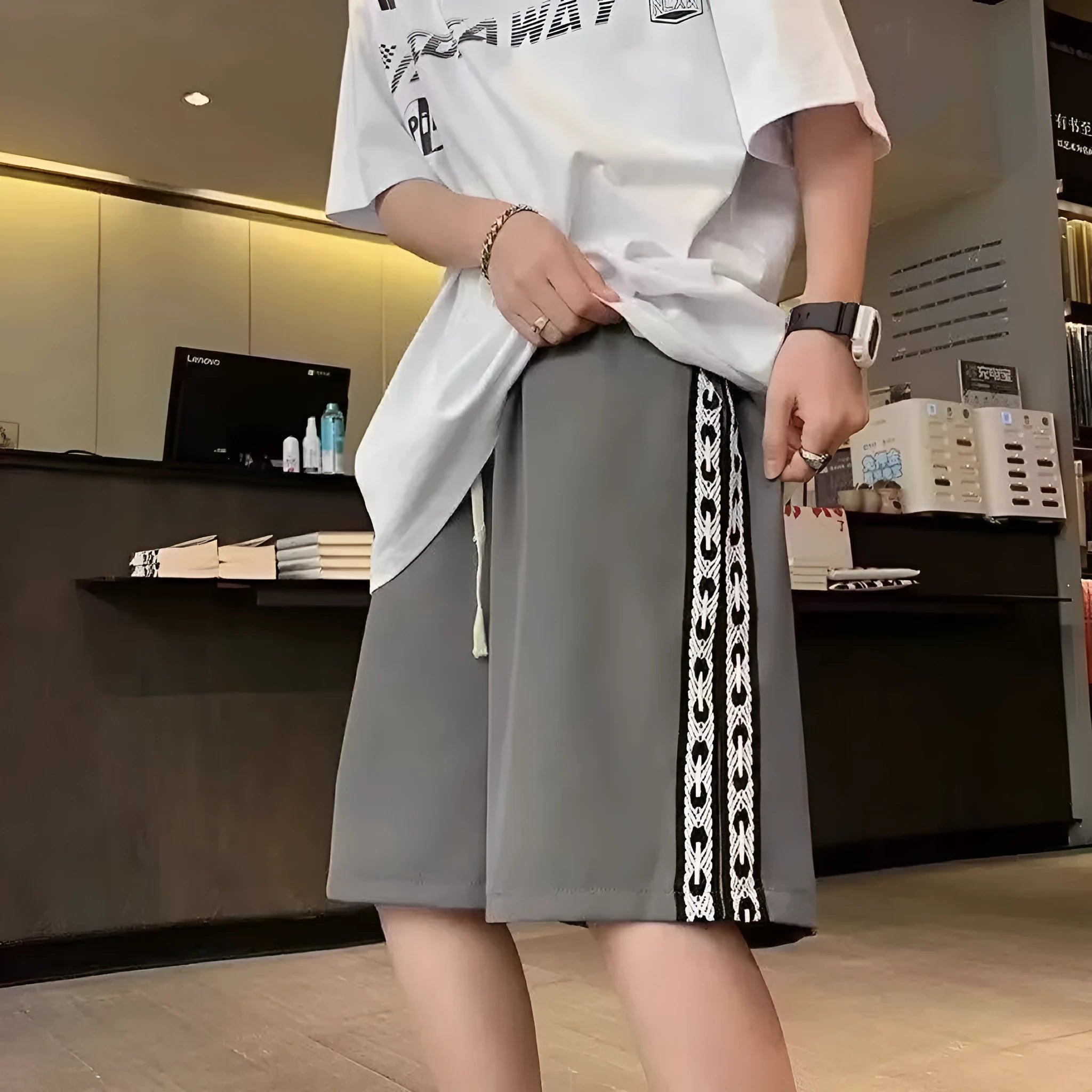 Men's loose fit track pants in black colour with elastic waistband and baggy leg cut
