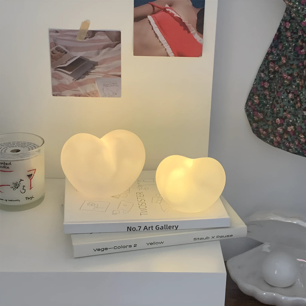 Small vinyl atmosphere lamp with warm glowing light in trumpet shape available in pink or white