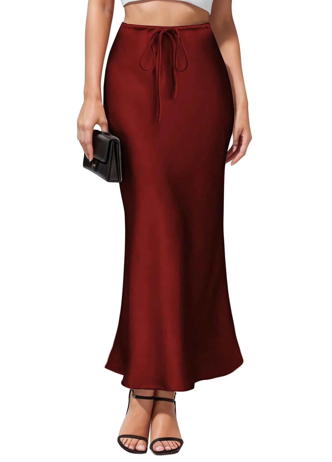 Women's high-waist asymmetric acetate skirt in black showing irregular hem detail