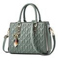 Women's large polyester messenger bag with multiple front pockets in green colour.