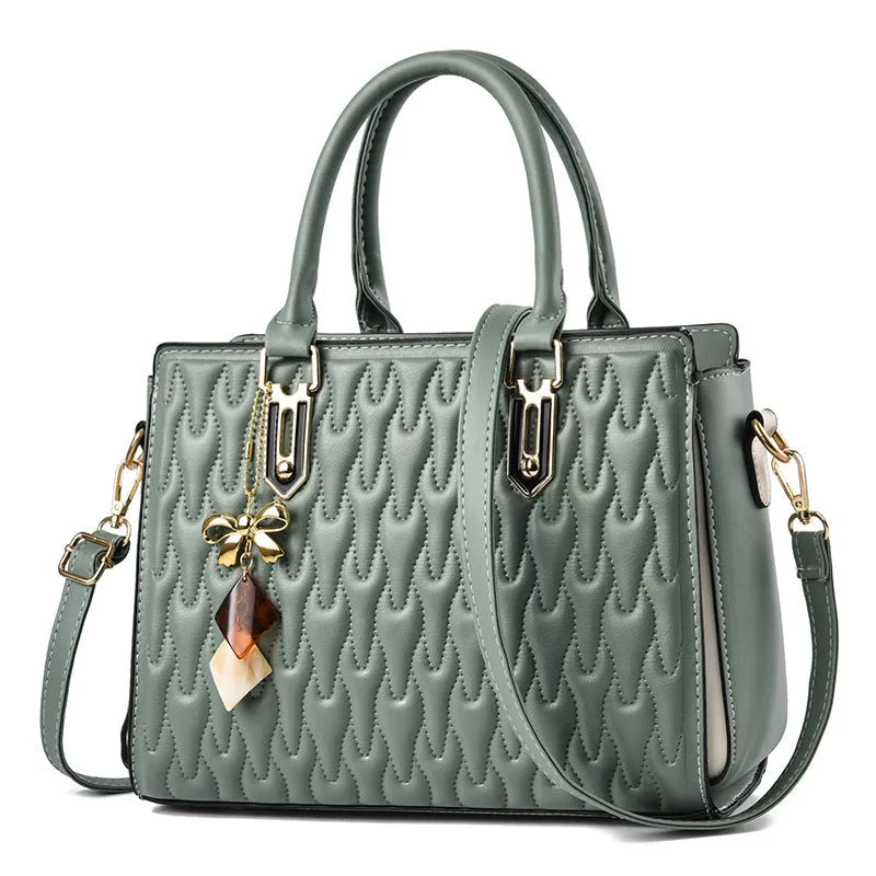Women's large polyester messenger bag with multiple front pockets in green colour.