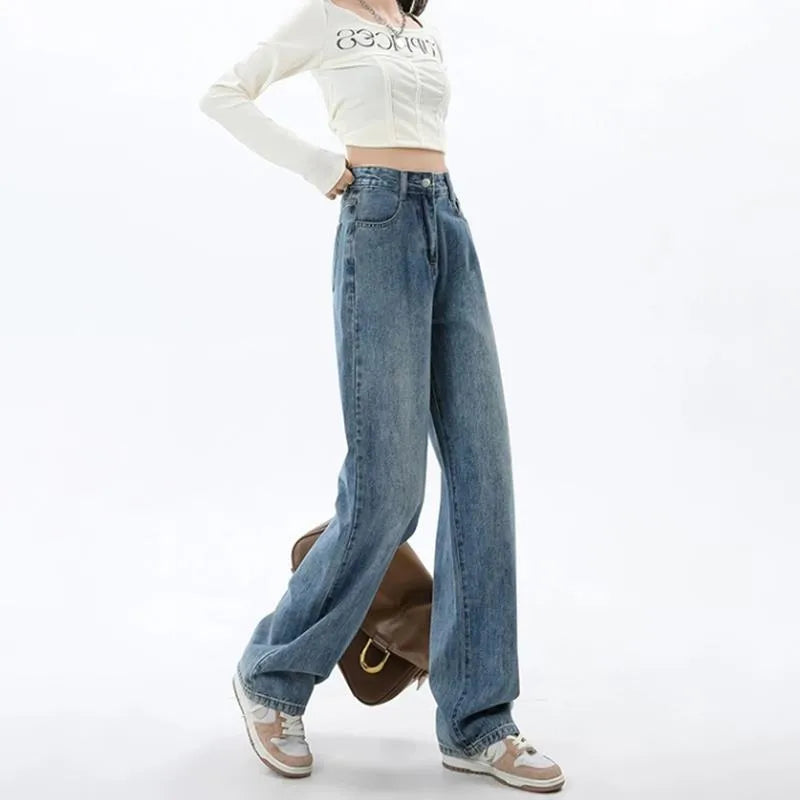Women's retro blue high-waist wide-leg jeans laid flat, showing straight leg cut and denim texture.