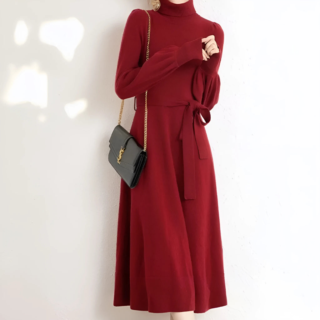 A rose red loose-fit turtleneck knit dress for women with long sleeves and a mid-length flared skirt.