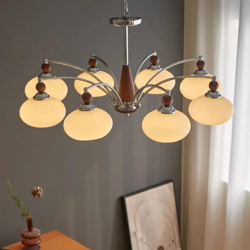 Traditional persimmon glass and chrome chandelier with multiple light heads for a dining room.