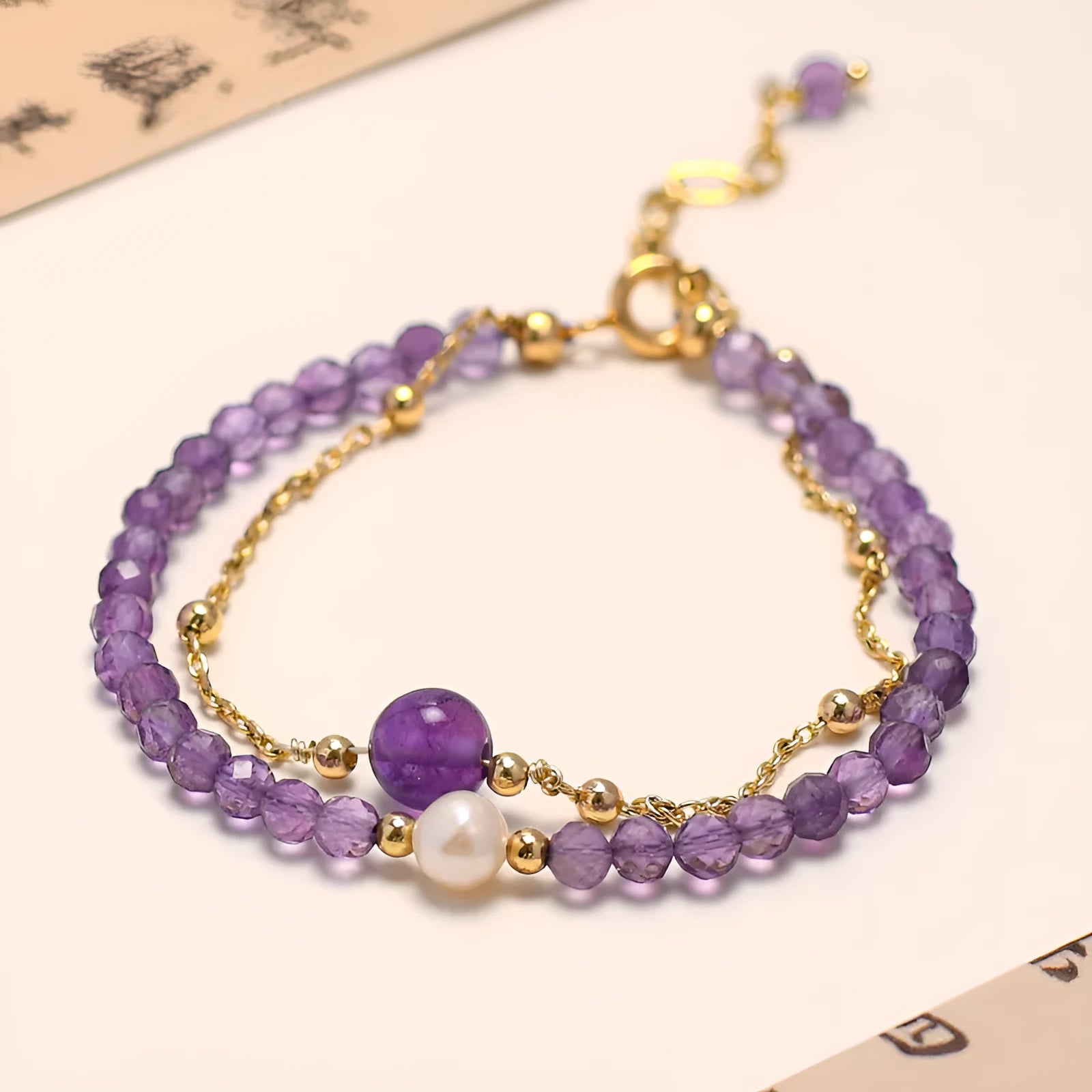 Women's amethyst Chinese style crystal bracelet with diamond-shaped beads and electroplated metal.