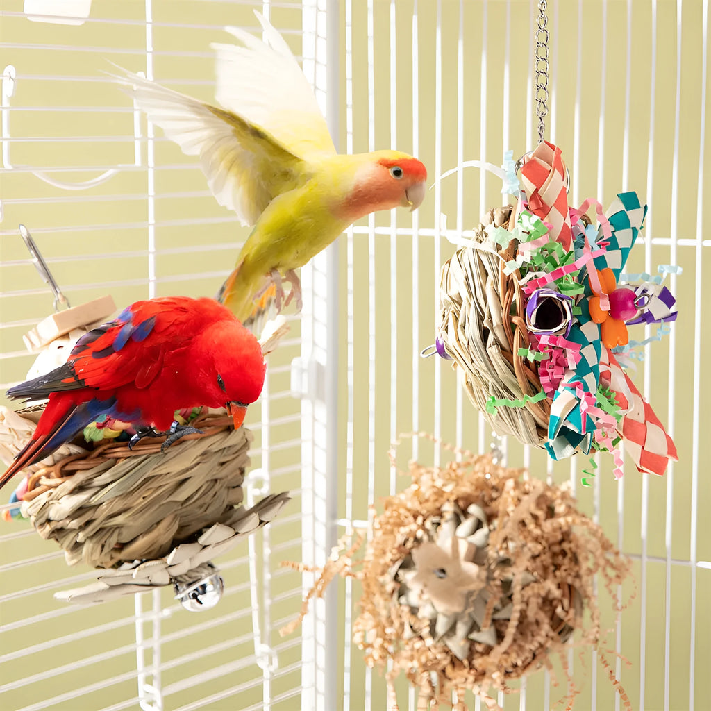 Three natural wood and rope parrot gnawing toys hanging as a bundle for large bird cage enrichment.
