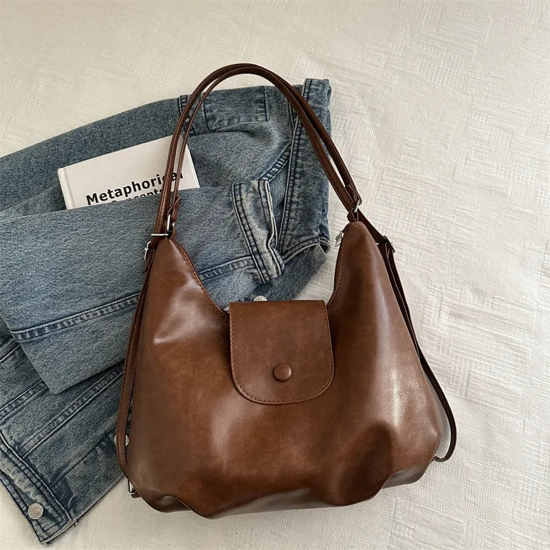 Women's black PU leather single shoulder bag with horizontal square shape and dedicated phone compartment