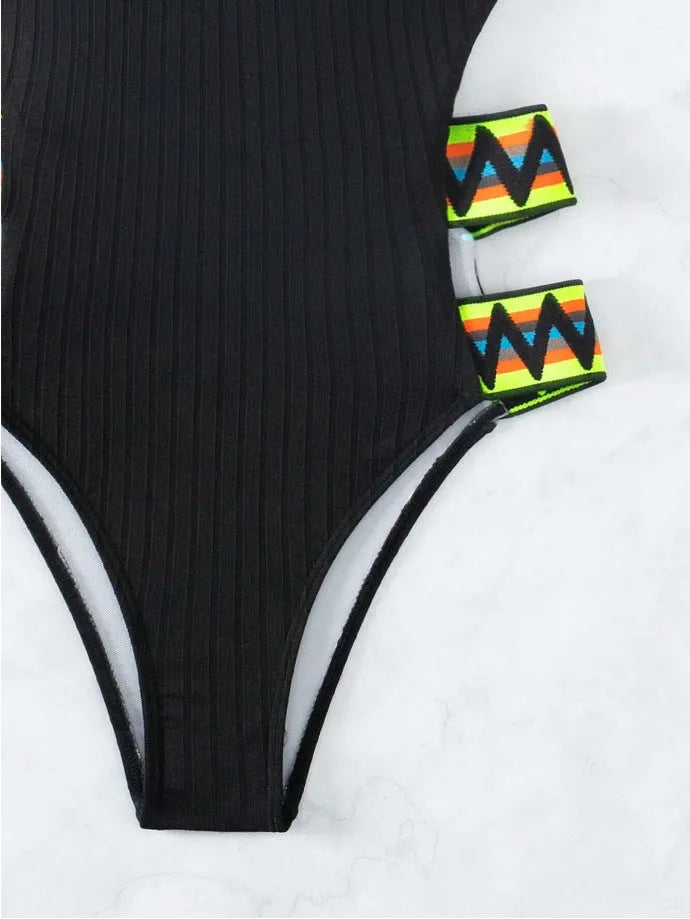Women's solid colour one-piece swimsuit bikini in black or orange polyester fabric