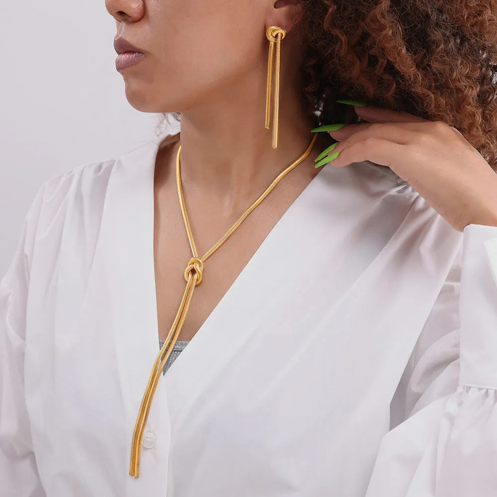 Gold electroplated titanium steel knotted tassel necklace with snake chain and matching earrings set