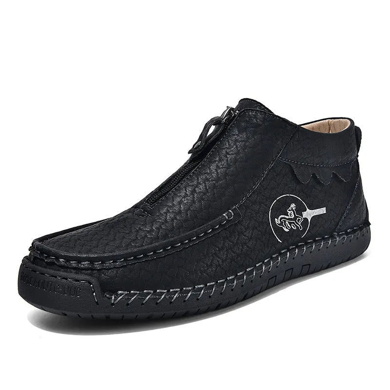 Men's black slip-on loafers with round toe and sewing thread detail on a rubber sole.
