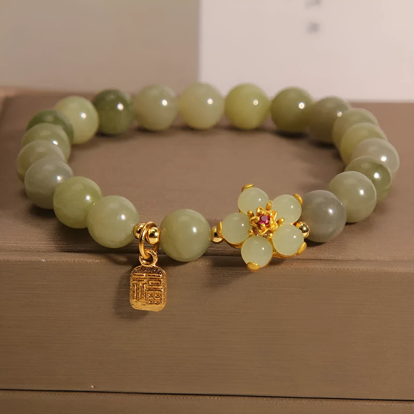 A women's casual alloy bracelet with a grey jade colour finish and a clasp.