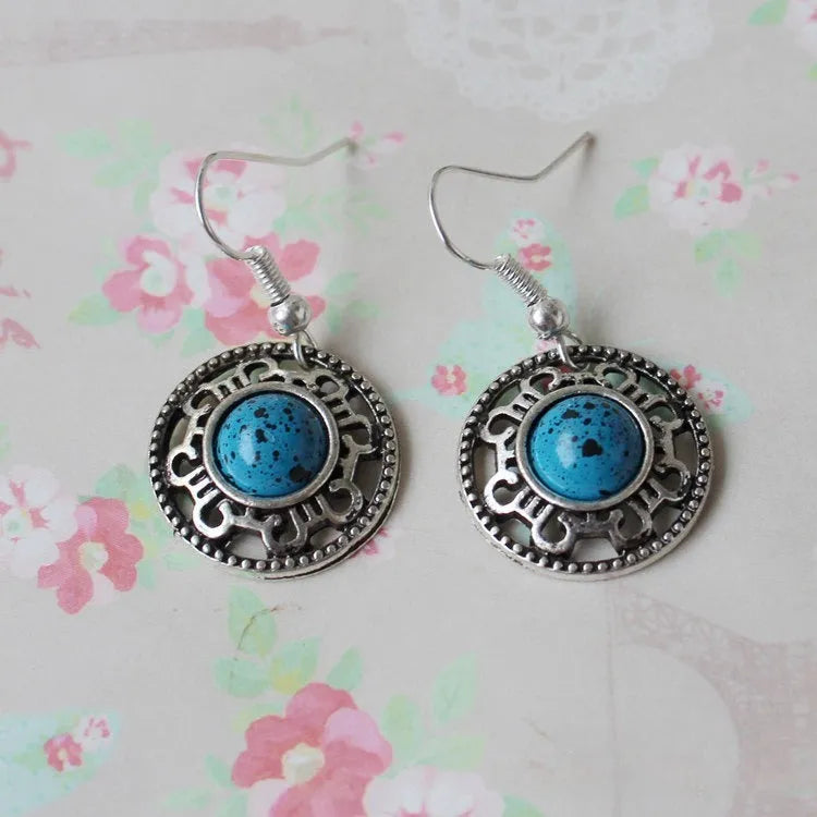 Handmade Miao silver turquoise earrings with geometric flower disk design and ethnic patterns