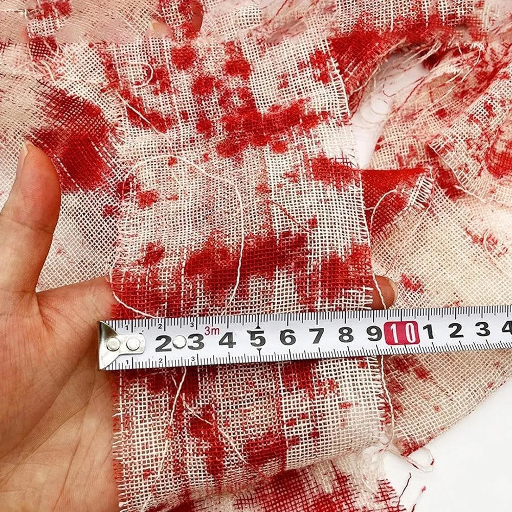 Halloween bloody red and white polyester gauze bandage rolls showing 8cm width, for decorations and costumes.