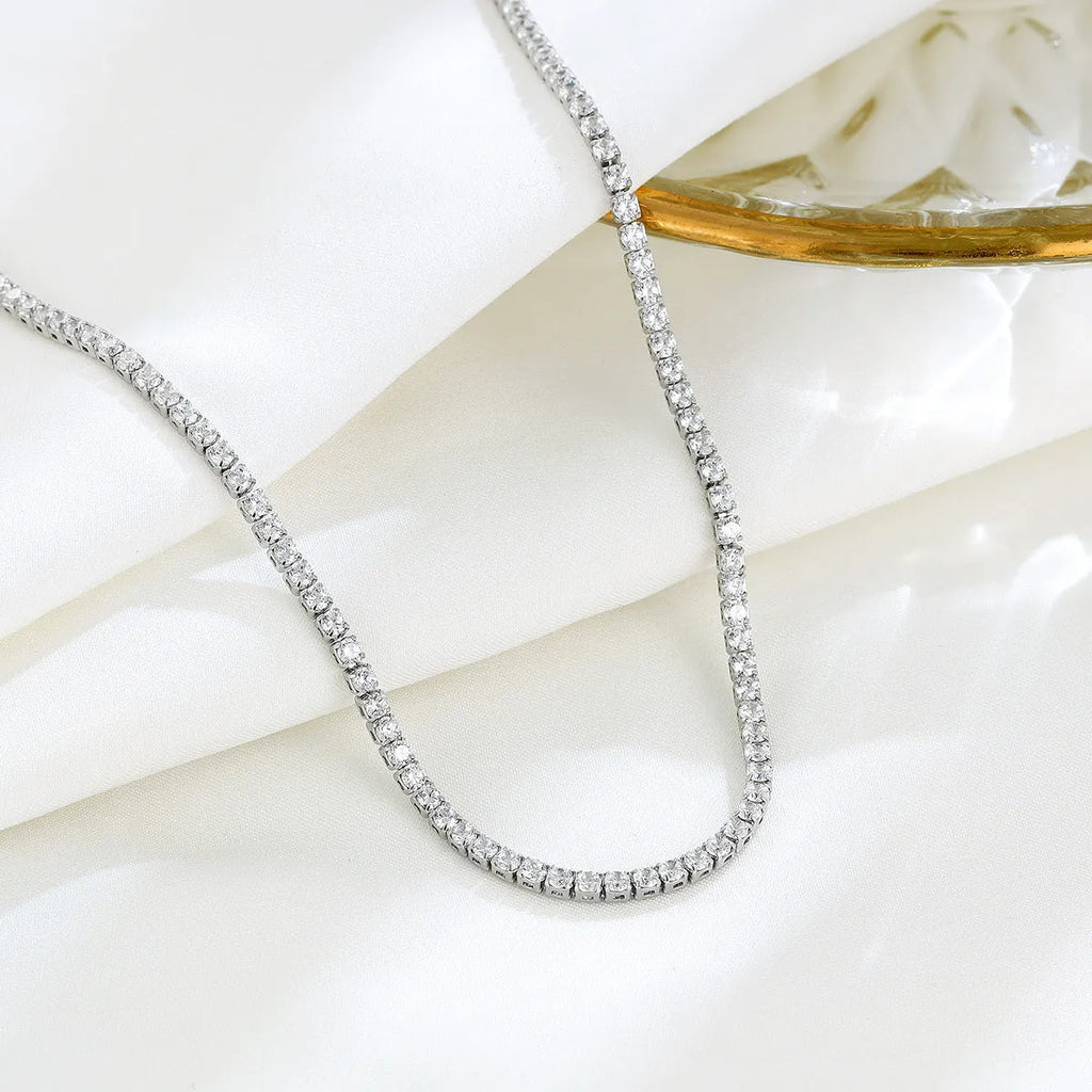 Women's sterling silver necklace with round pendant, diamond treatment finish