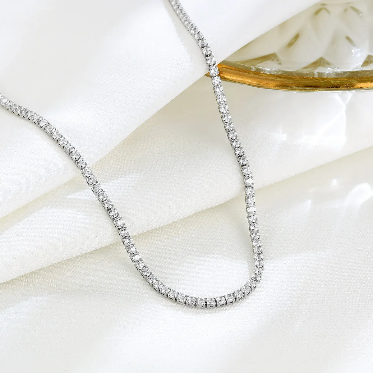 Women's sterling silver necklace with round pendant, diamond treatment finish