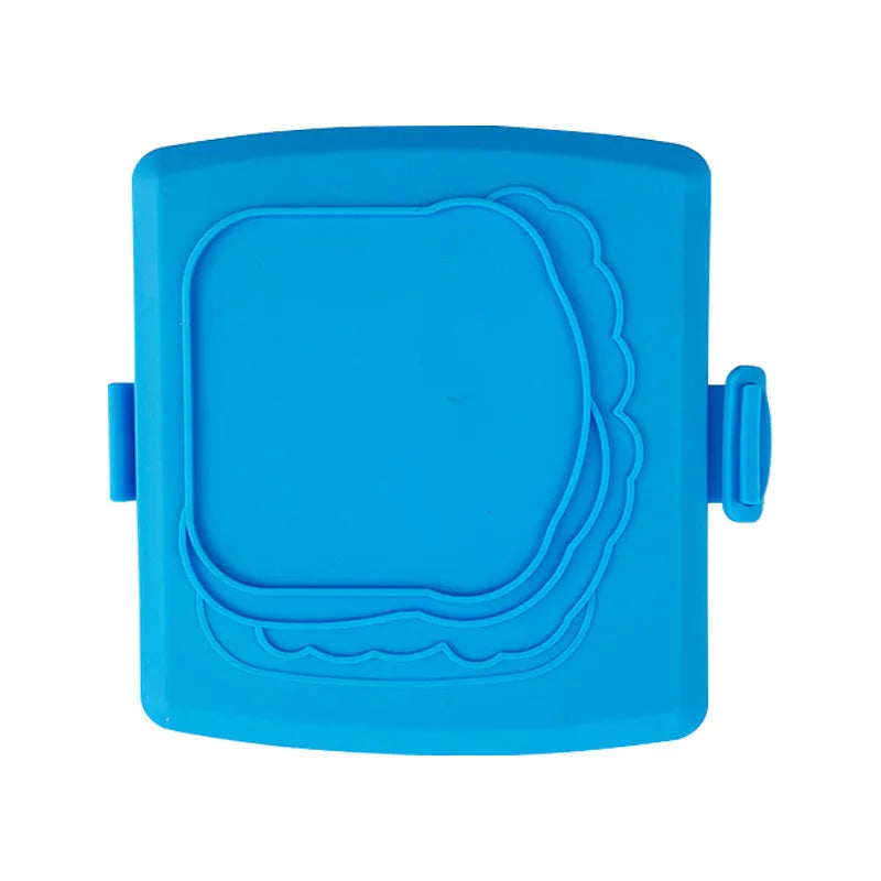 Red silicone baking tray with matching heat-resistant gloves on a kitchen counter.