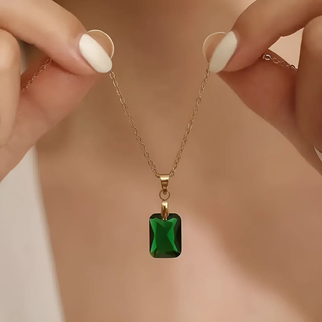 Copper geometric necklace with green rectangular quadrilateral pendant on an O-ring chain.