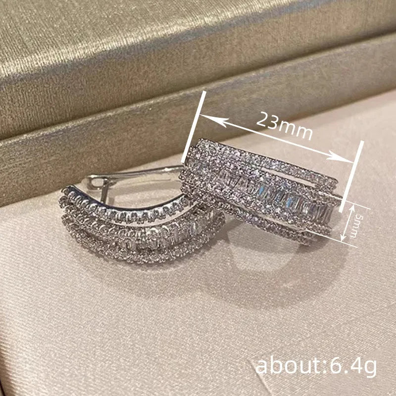Geometric copper stud earrings with inlaid zircon stones in white gold colour