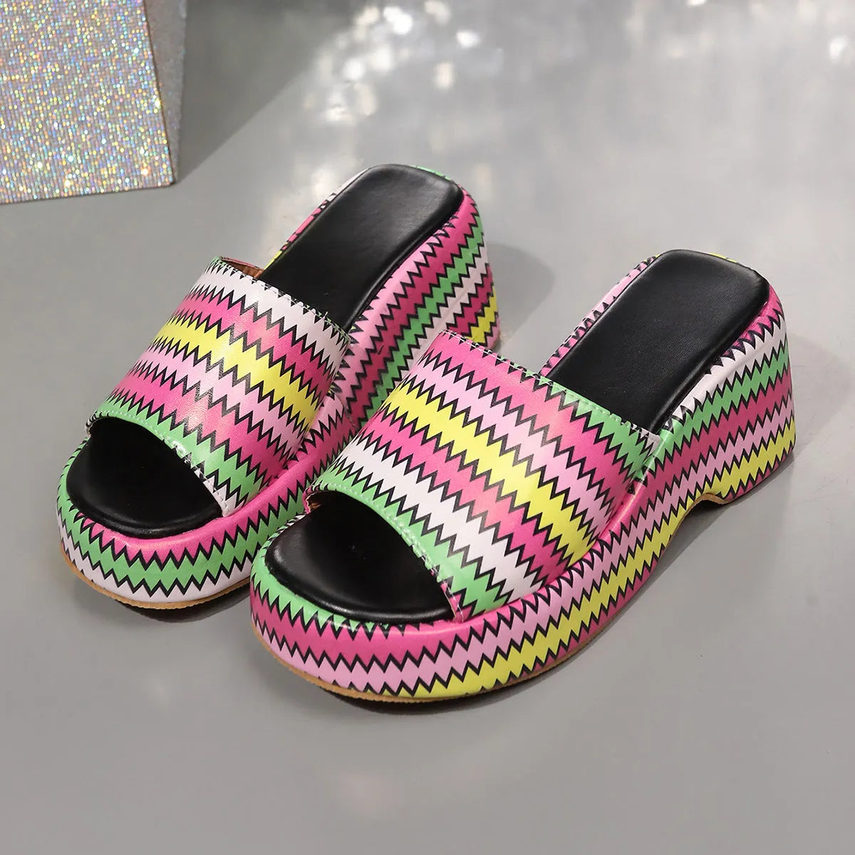 Women's beige wedge sandals with blue wave print design, fish mouth toe, and a thick rubber sole.