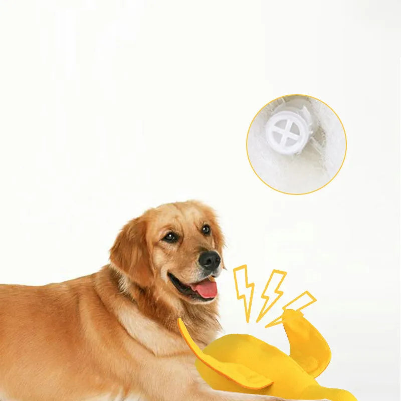 Yellow plush duck dog toy with treat compartments and squeaker for training