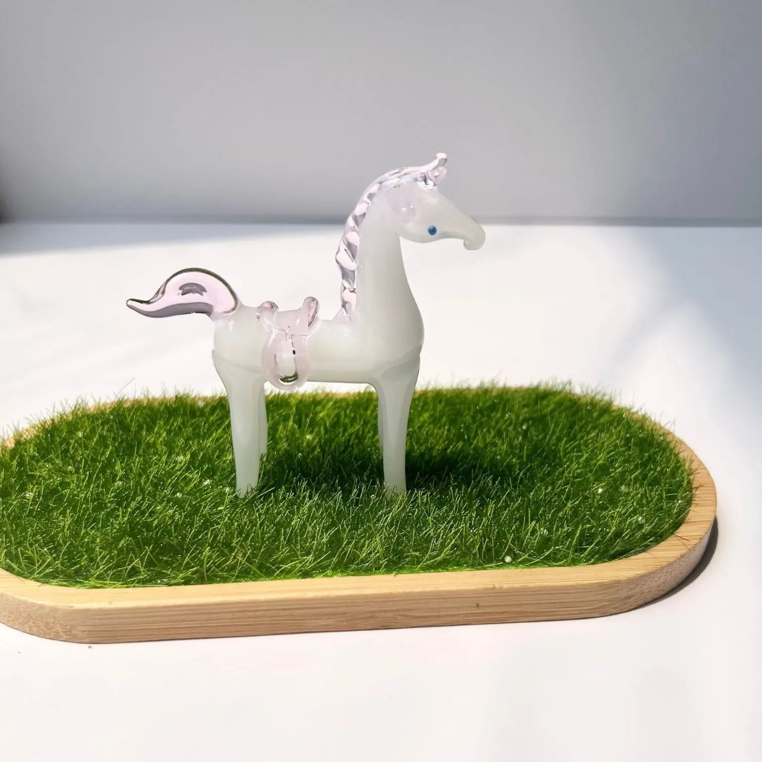 Brown glazed ceramic horse decoration on wooden desk with modern simplicity design