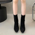 Brown women's square toe mid calf boots with a side zipper and a low kitten heel.