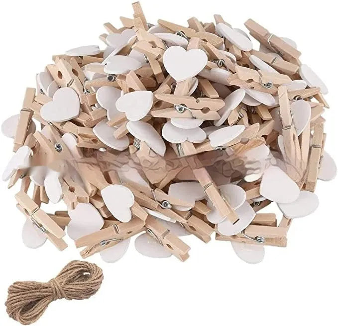 Pack of five solid wood heart-shaped clips in assorted colours on a white background.