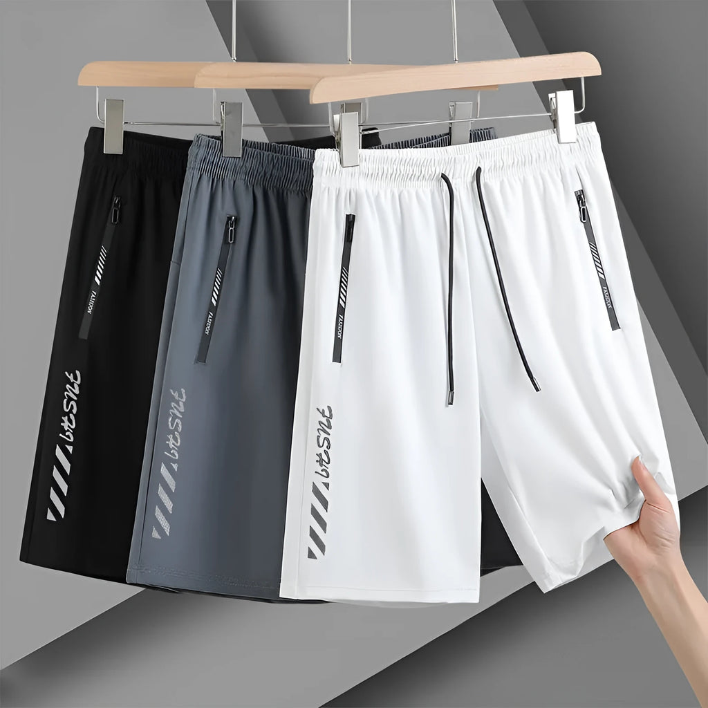 Man wearing black loose-fit quick-drying nylon sports shorts for summer.