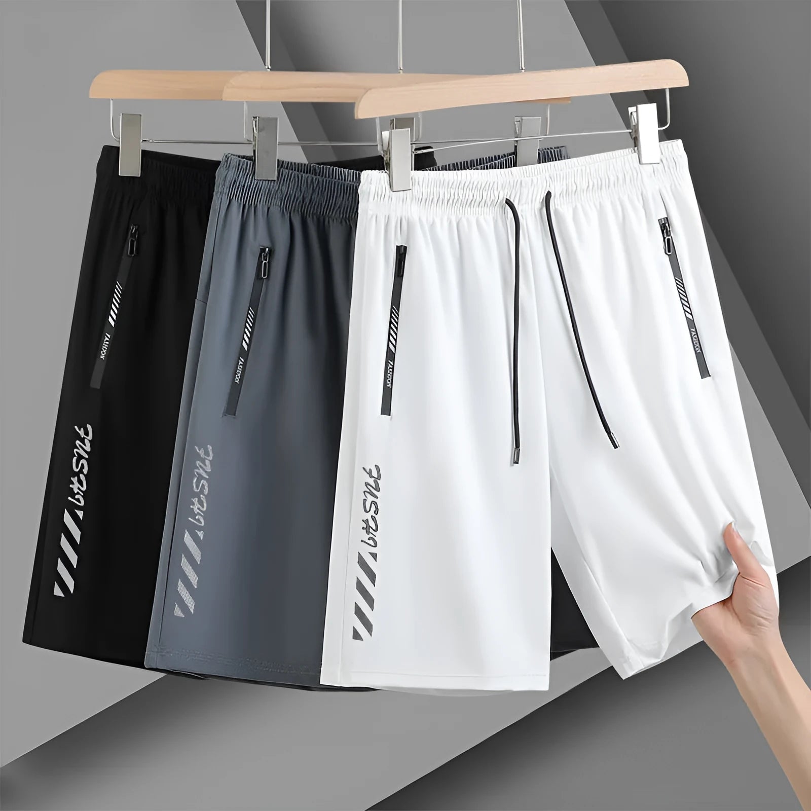 Man wearing black loose-fit quick-drying nylon sports shorts for summer.