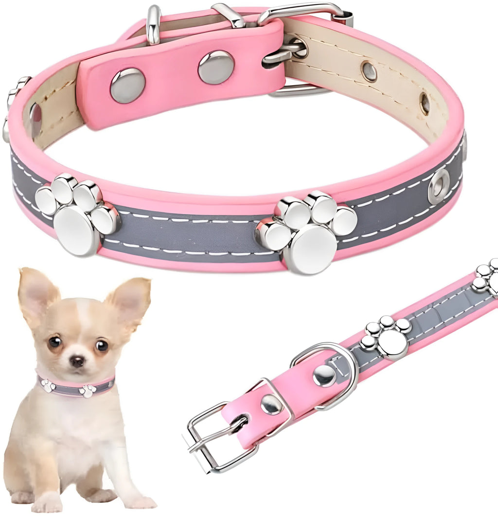 Reflective PU leather dog collar with metal paw rivets and an adjustable buckle on a grey background.