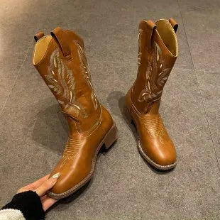 Brown women's embroidered mid-calf martin boots with leather lining and a square heel.
