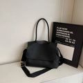 Square synthetic leather tote bag with double straps in a neutral colour.
