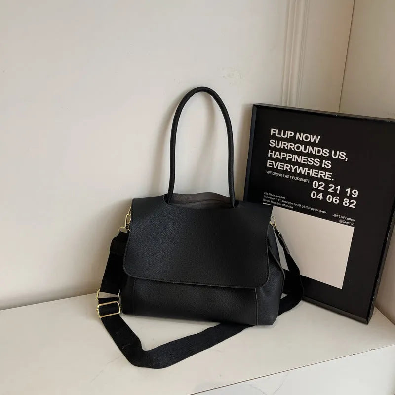 Square synthetic leather tote bag with double straps in a neutral colour.