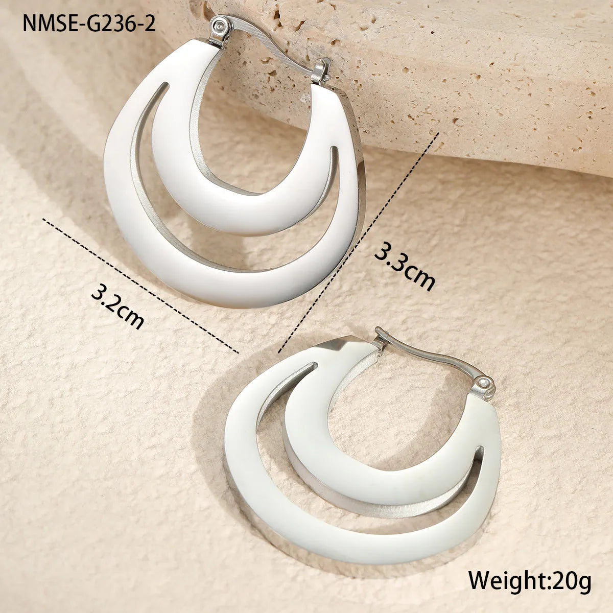 A pair of women's geometric French earrings with a round ring design, available in gold or steel colour.