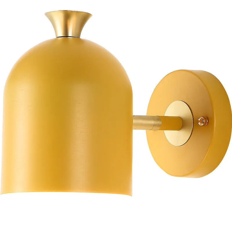 Blue aluminium single-head LED wall lamp mounted beside a bed.