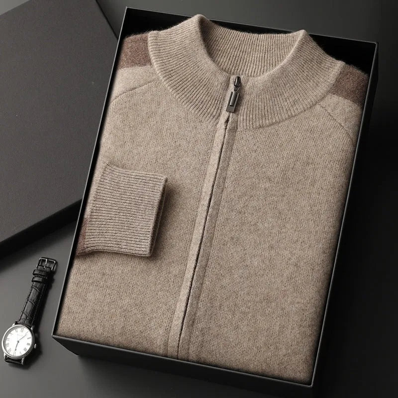 Men's navy blue cashmere blend knitted cardigan suit with half turtleneck and zip, paired with matching trousers.