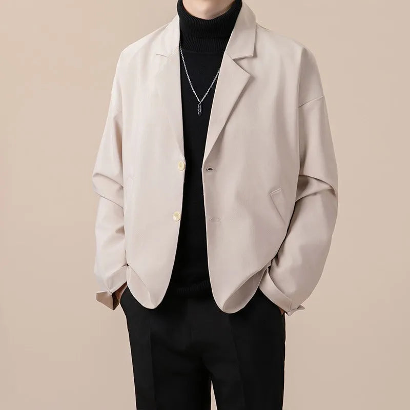 A man's loose-fit casual suit jacket in a polyester blend fabric, shown in one of four available colours.