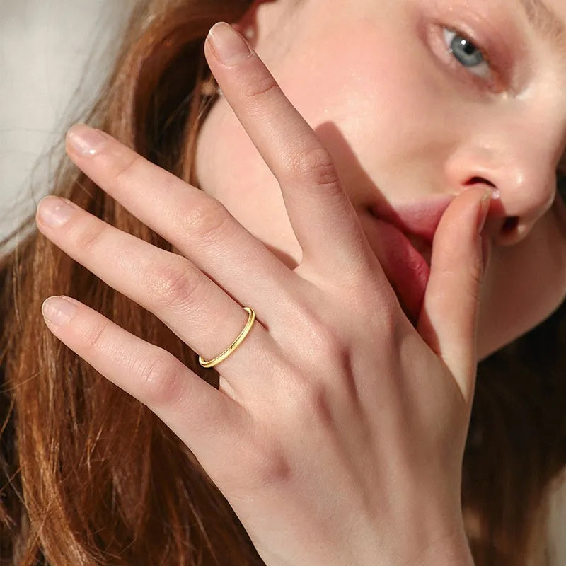 Geometric round bracelet ring in sterling silver, gold, or platinum finish on a jewellery display.