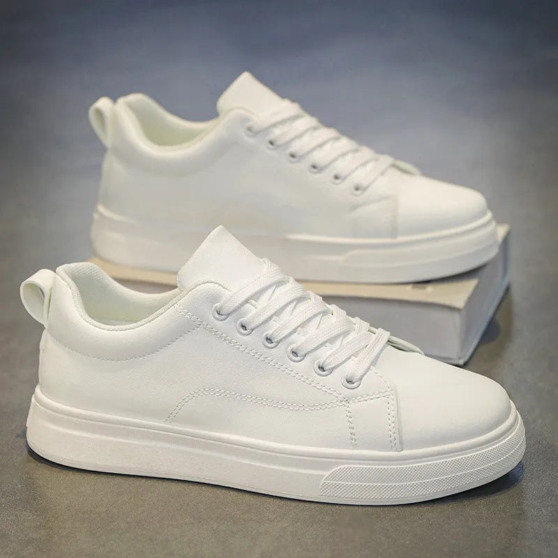 Men's low-top Korean-style sneakers in white and black colour options with round toe and flat rubber sole